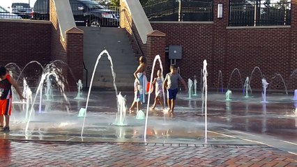 Super Hero Kids Playing In The Water Park