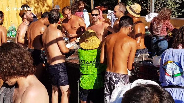 Rowdy Portugal football fans play music on dishes