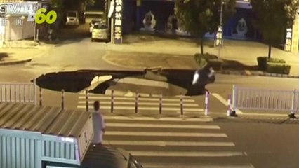 Shocking Video of Man on Scooter Falling Into Massive Sinkhole Because He Was On Phone