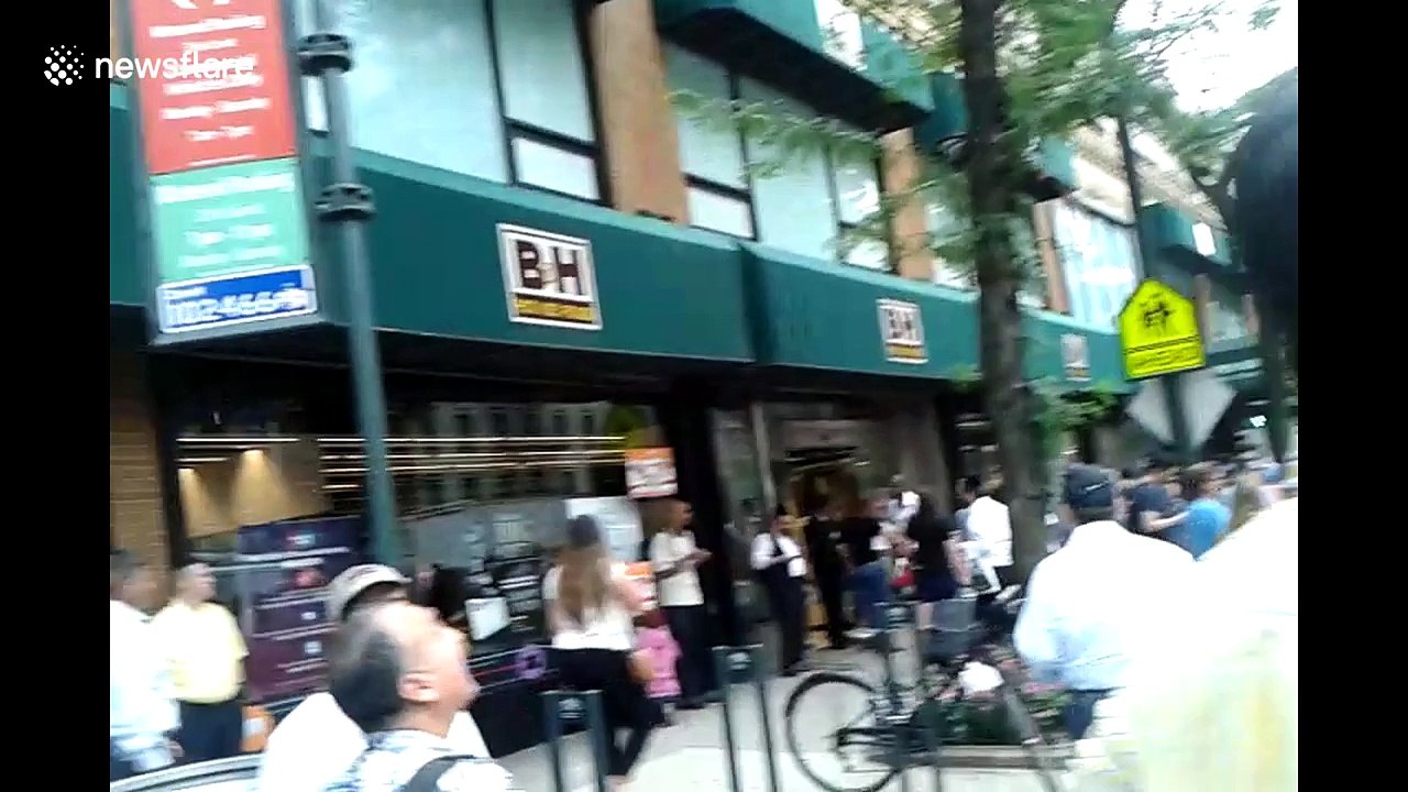 People watch solar eclipse in New York City
