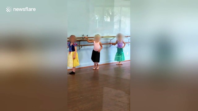 Little girl attends ballet class dressed as a hotdog