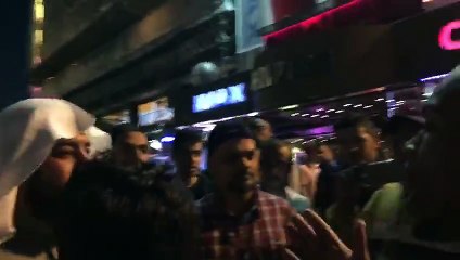 In Leicester square, London, England. A Muslim and christian arguing about religion