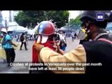 Violinist keeps playing through clashes in Venezuela