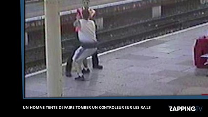 Un homme tente de pousser un contrôleur sur les rails d'un train (vidéo)
