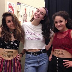 Male students wear vest tops in protest against school's 'sexist' dress code