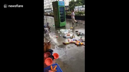 Passersby blown off their feet by Typhoon Hato in southern China