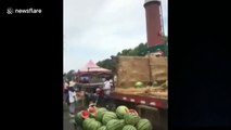 Chinese vendor catches watermelons with one hand