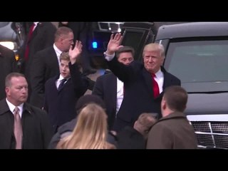 President Trump and family walk toward White House in inaugural parade