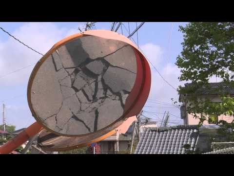 Rescuers race against landslides to reach Japan quake victims