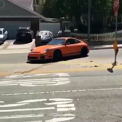 Porsche 911 GT3 drawing some circles on the street