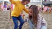 Little girl Moves the Beach to the Shopping Centre