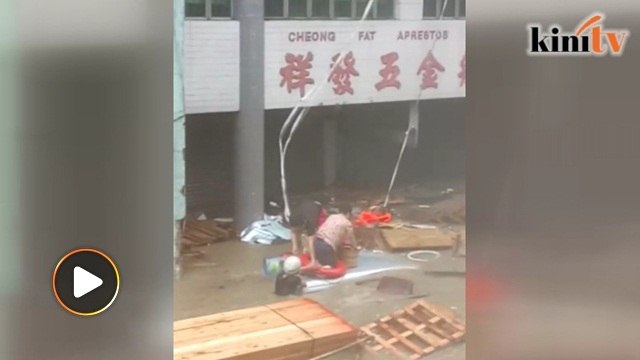 Man saves two from getting swept away by floods in Macau