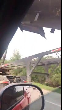 Driver Witnesses Dump Truck Crash Into Highway Sign in Jacinto City, Texas