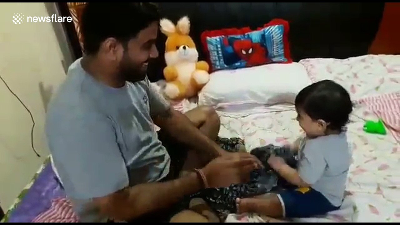 Baby breaks into tears after father shaves beard