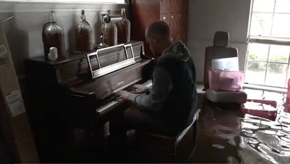 Houston Musician Plays Piano In Flooded Home