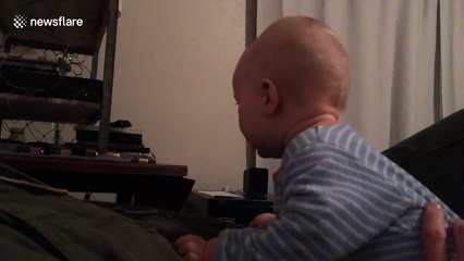 Baby is terrified by Chewbacca mask