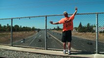 Man Delivers Inspiring Message from Freeway Overpass