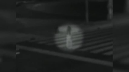 SHOCKING -  Ghost of a young girl stands in the middle of the road, as cars pass through her