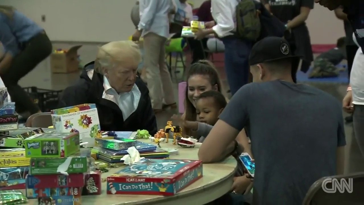 Trump visits with Harvey victims, serves food