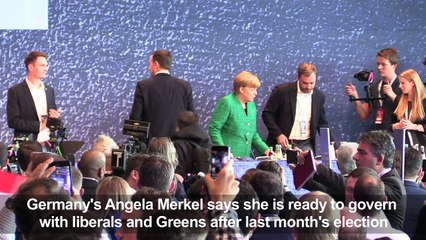 Merkel confirms she is ready to govern with liberals and Greens