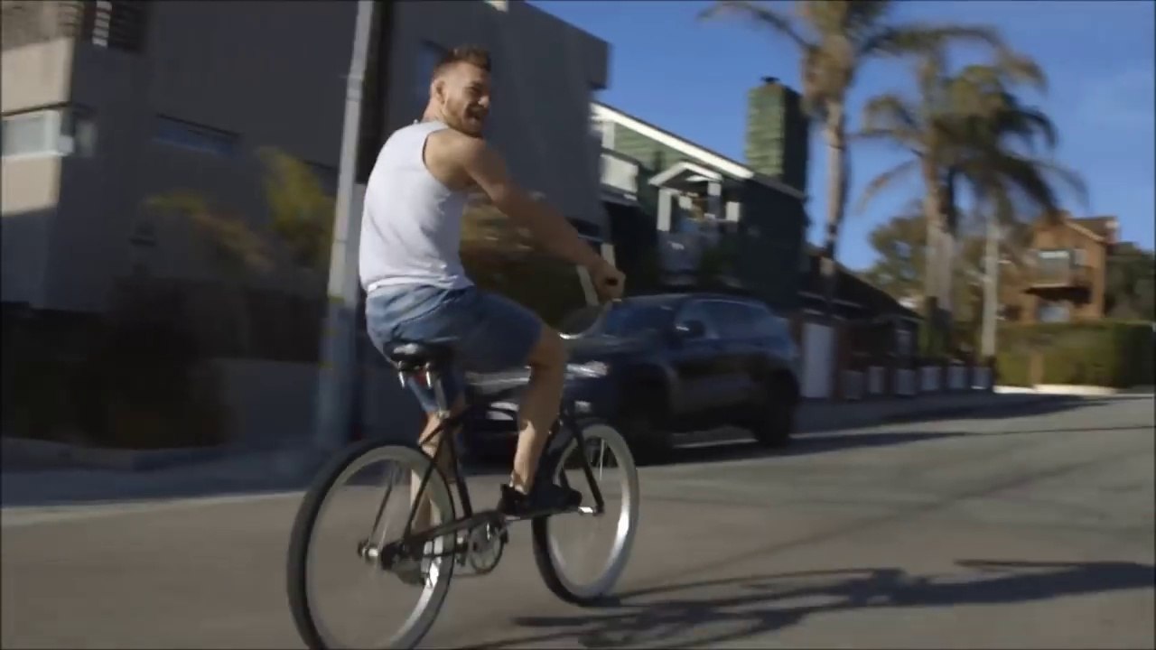 Conor McGregor riding bike singing Snoop Dogg