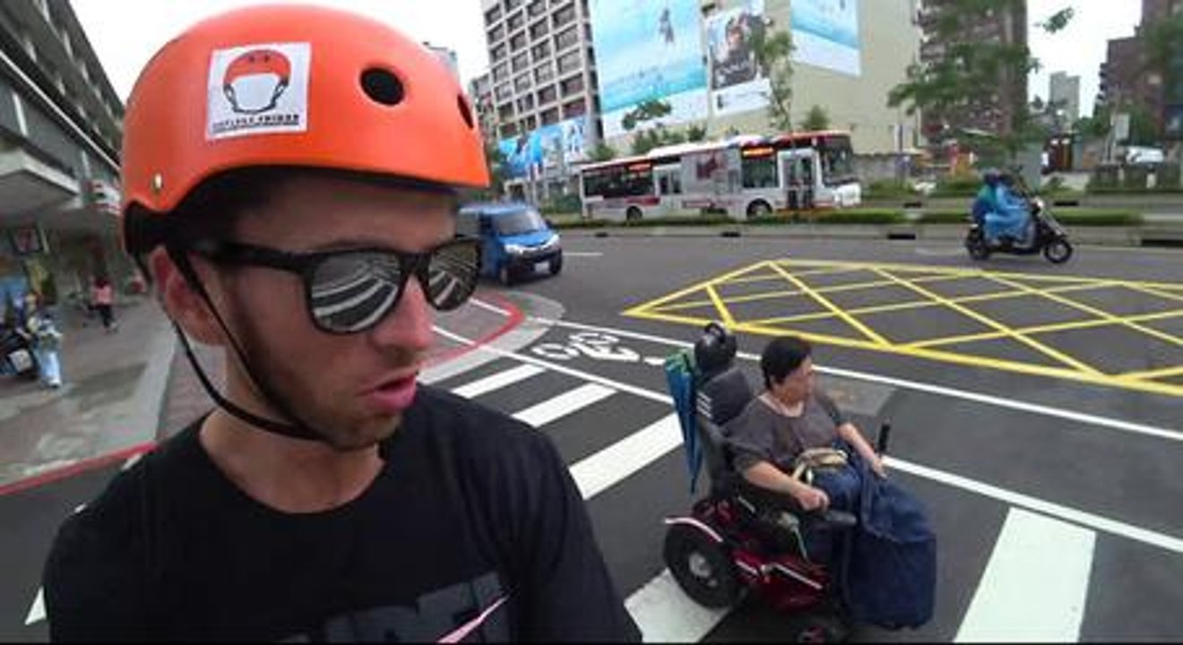 Guy On Electric Skateboard Races Woman On Electric Wheelchair