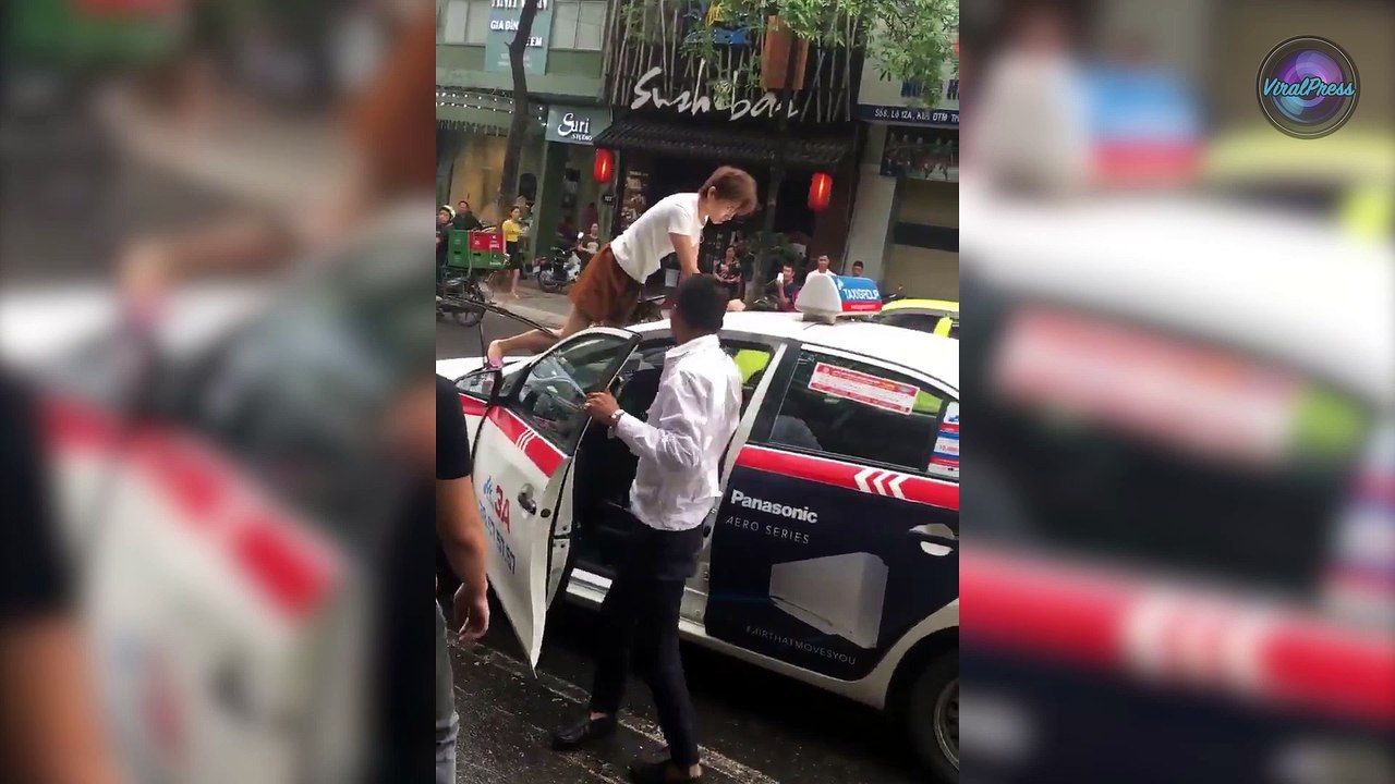 Angry Woman Climbs Onto Taxi Roof