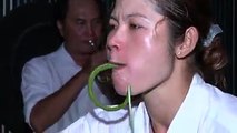 Amazing phenomenal woman eating snakes