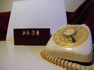 Rotary phone calculator sleeping. IN-12