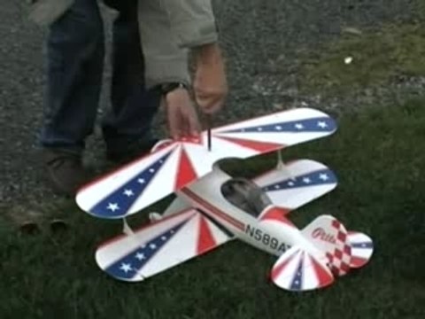 Art Tech Pitts Special R/C Biplane, flying at shorefront.