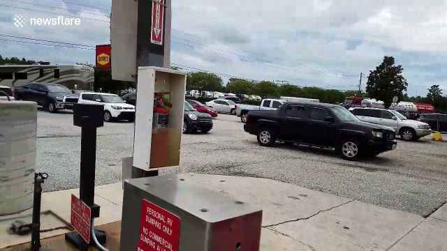 Cars line up at Florida petrol station before Hurricane Irma hits