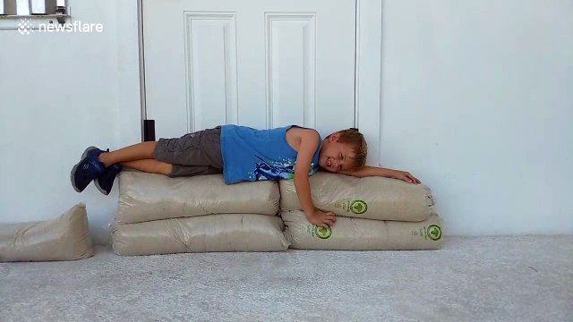 Four-year-old helps with sandbags in the Bahamas before Hurricane Irma