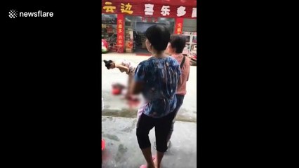 Woman gives birth on the street in China