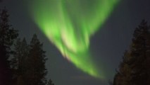 Beautiful Northern lights illuminate sky in Finland