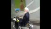 An Iranian driving a motorcycle in a funny way