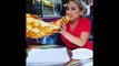 Woman Eating A Giant Slice Of Pizza