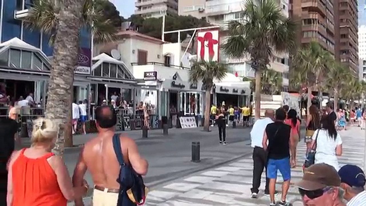 beautiful girls dancing in front of the beach, Benidorm, Spain