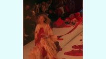 Turkish designer's runway show resembles a massacre as models covered in fake blood step over 'bodies' on the catwalk at