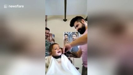 Baby gets first haircut and really enjoys it
