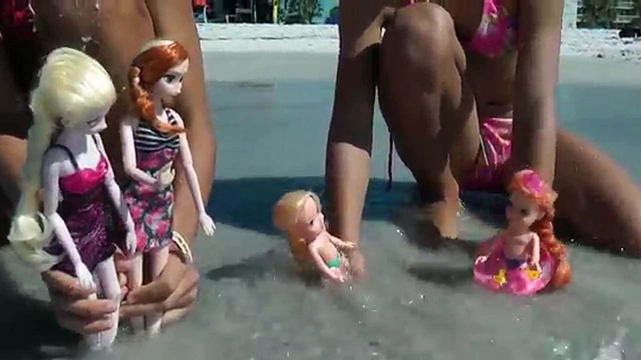 DOLPHINS ! Elsa and Anna toddlers swim in the OCEAN and watch DOLPHINS! Splash Water fun