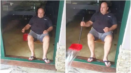 Lazy Man Uses Dust Pan to Throw Water out of Cafe