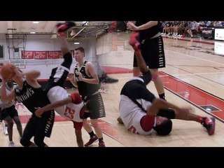 Player Knees Himself In The Face in Scary Basketball Play