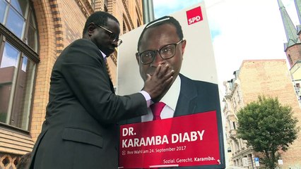 In re-election battle, Germany's first black MP fights hate