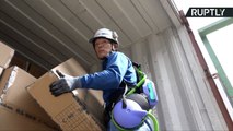 Japanese Shipyard Workers Use Robotic Exoskeleton to Help with Heavy Lifting