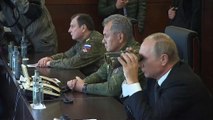 Vladimir Putin looks on as Russia flexes its military muscles