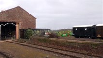 UK Steam Engine pulling a Goods Train out of a Shed