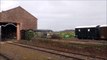 UK Steam Engine pulling a Goods Train out of a Shed