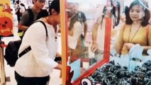 Chinese woman catches ten live crabs from claw machine