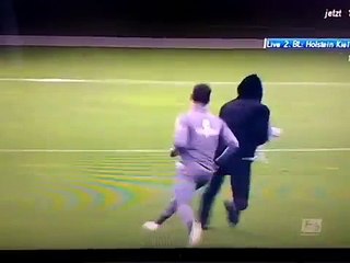 St. Pauli players stop pitch invaders before the game vs Kiel!