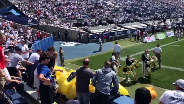 Parachute jumper crash lands into a wall at BYU-Wisconsin game.